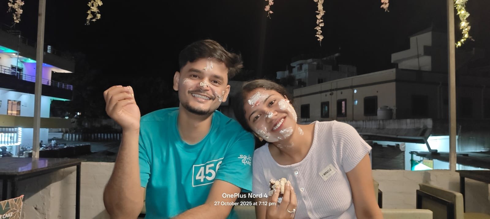 Us smiling after a playful cake fight