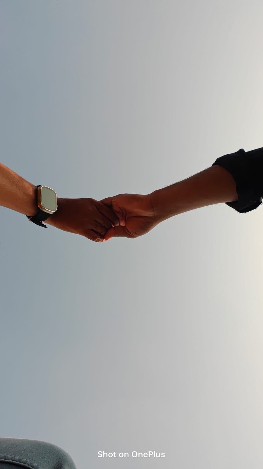 Our hands linked against the open sky