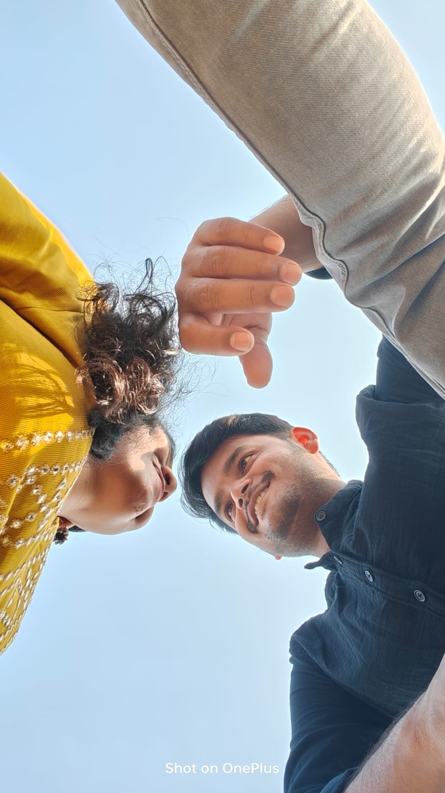 Us smiling at each other from a playful low angle