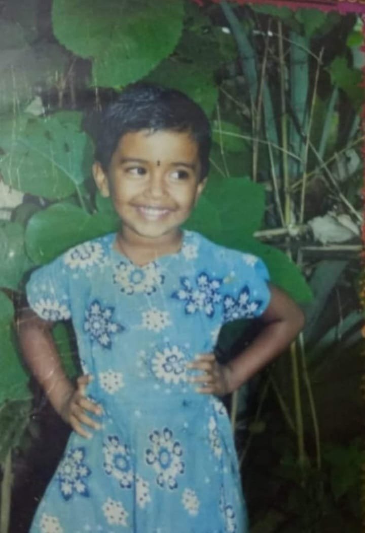 Pandill as a happy little girl